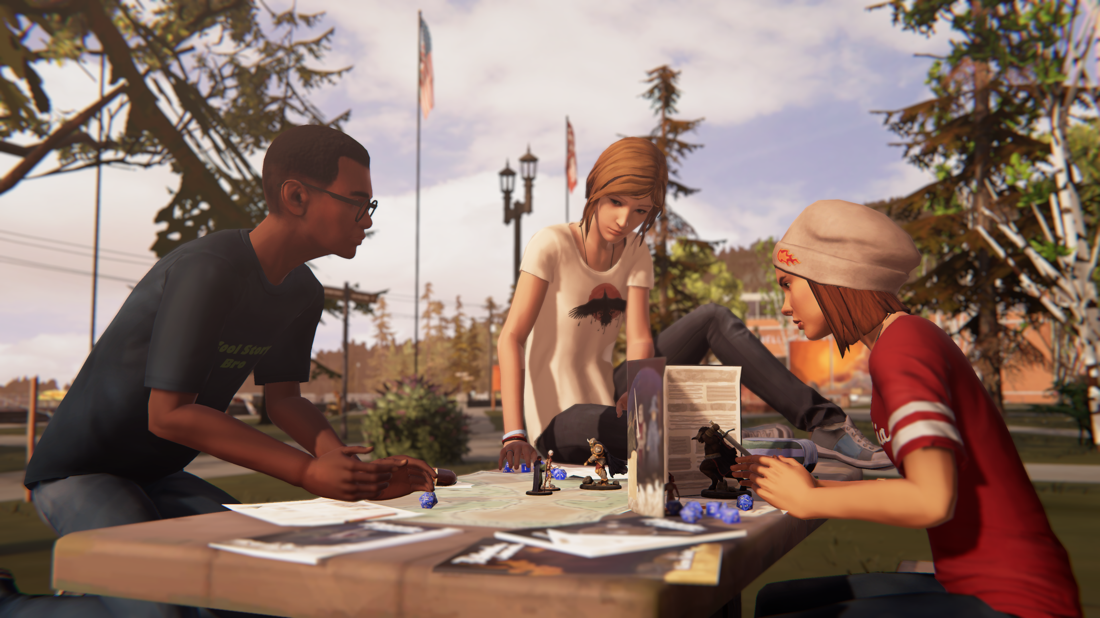 Mikey North, Chloe, and Steph Gingrich play a tabletop roleplaying game in the Blackwell Academy quad.