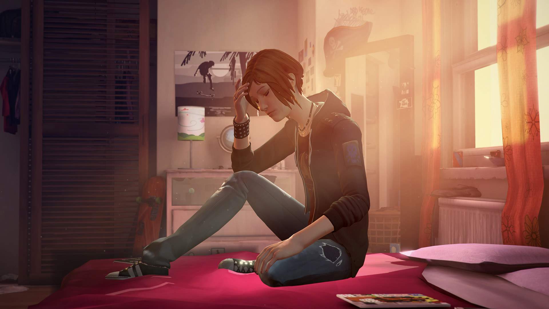 Head in hand, and lost in thought, Chloe sits on her bed as the afternoon sun spills through her window.