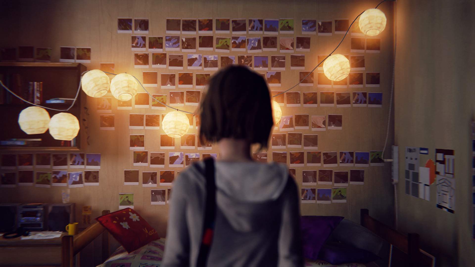 Max, in the centre of the frame, regards her dorm room wall, which is crowded with hundreds of her polaroid pictures.