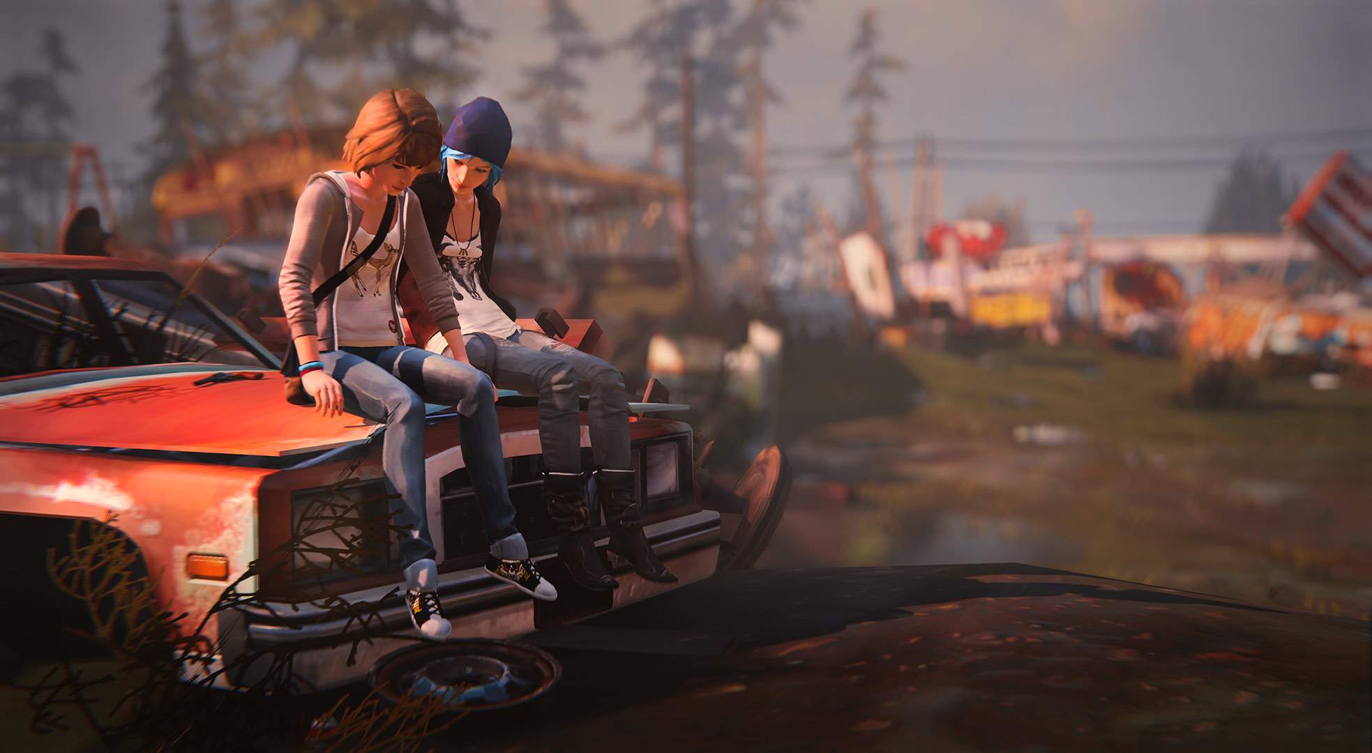 Afternoon in a grassy junkyard. Max and Chloe sit contemplatively on the hood of a rusted red sedan.